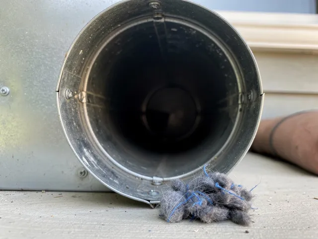 Avocado Heights Dryer Vent Cleaning technician using specialized equipment to clear severe dryer vent blockage in Avocado Heights